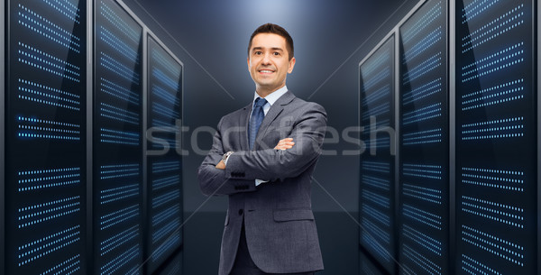 smiling businessman over server room background Stock photo © dolgachov