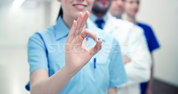 close up of doctors at hospital showing ok sign Stock photo © dolgachov