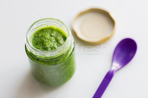 jar of vegetable puree or baby food and spoon Stock photo © dolgachov