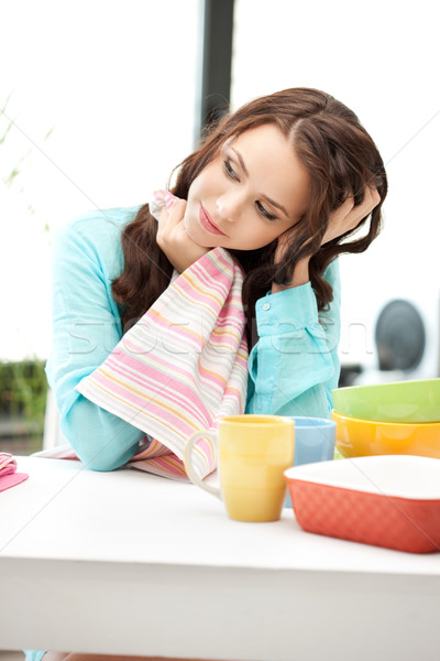 lovely housewife at the kitchen Stock photo © dolgachov