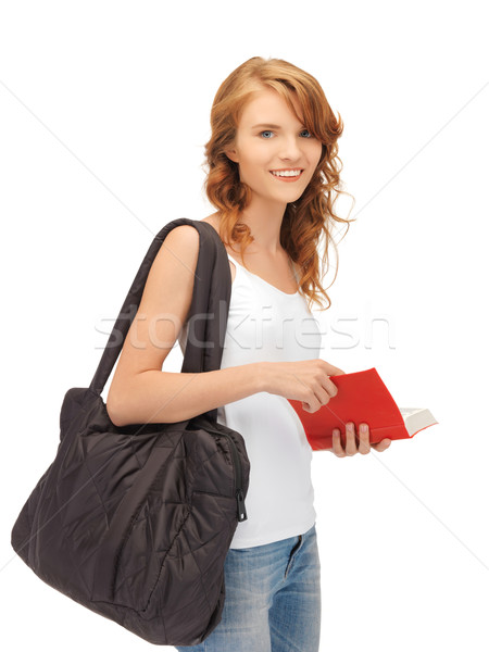 teenage girl in blank white t-shirt with book Stock photo © dolgachov