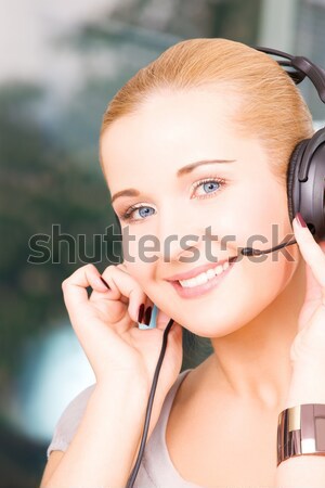 Stock photo: beautiful woman in red mittens with snow