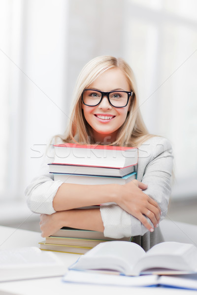 Studente libri foto sorridere donna Foto d'archivio © dolgachov