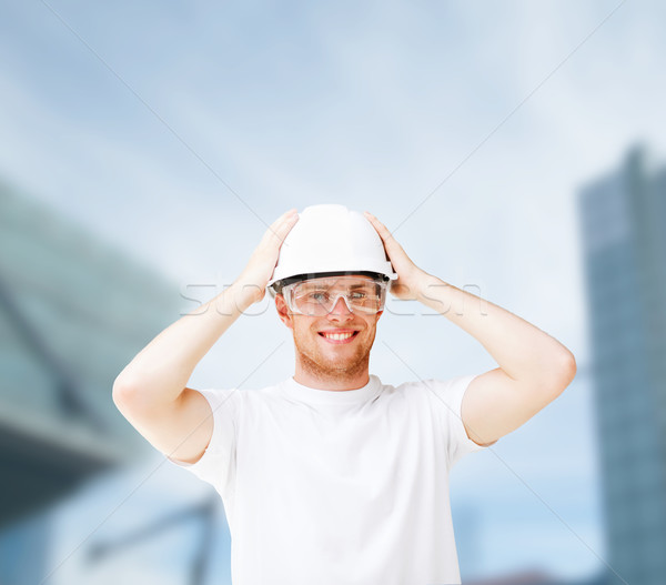 Masculina arquitecto casco gafas de seguridad edificio desarrollo Foto stock © dolgachov