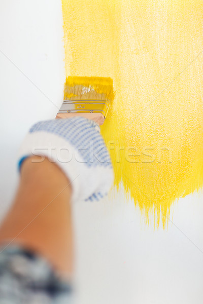 close up of male in gloves holding paintbrush Stock photo © dolgachov