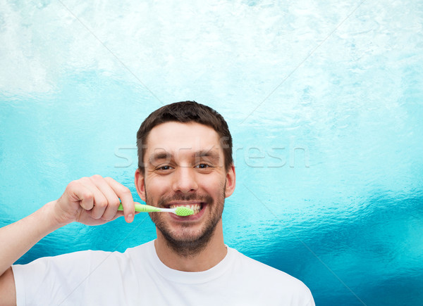 Sorridente moço escova de dentes saúde beleza sorrir Foto stock © dolgachov