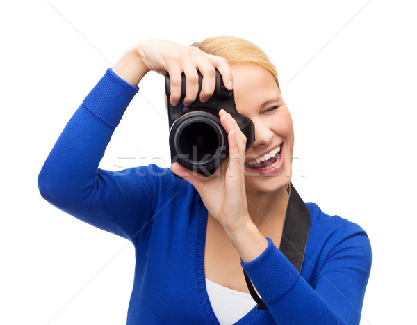 Femme souriante photos appareil photo numérique modernes technologie Photo stock © dolgachov