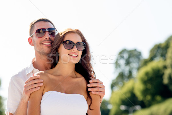 smiling couple in city Stock photo © dolgachov