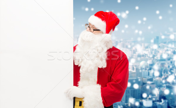 man in costume of santa claus with billboard Stock photo © dolgachov