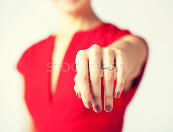 woman showing wedding ring on her hand Stock photo © dolgachov