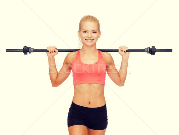 Uśmiechnięty kobieta sztanga fitness Zdjęcia stock © dolgachov