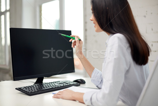 close up of woman with computer monitor in office Stock photo © dolgachov