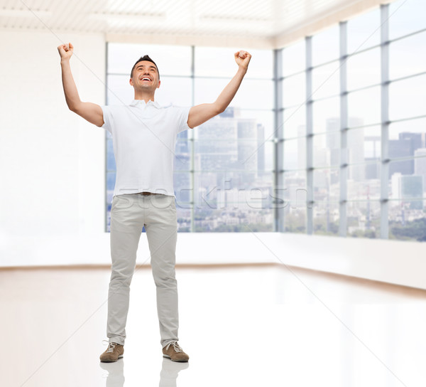 счастливым человека поднятыми руками недвижимости продажи бизнеса Сток-фото © dolgachov