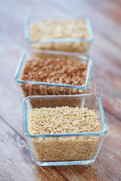 close up of grain in glass bowls on wooden table Stock photo © dolgachov