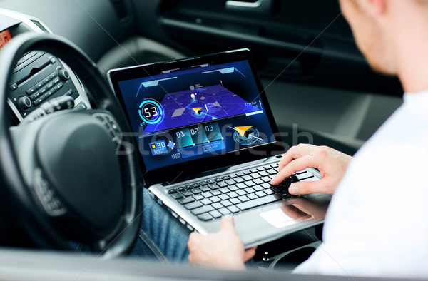 man using navigation on laptop computer in car Stock photo © dolgachov