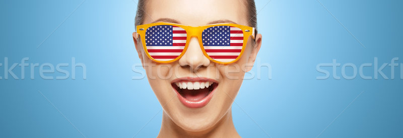 happy teenage girl in glasses with american flag Stock photo © dolgachov