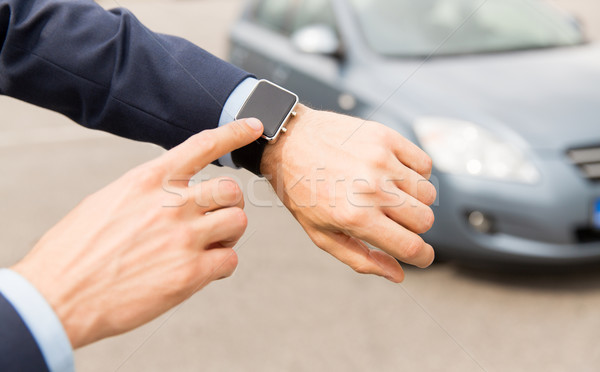 close up of male hands with wristwatch and car Stock photo © dolgachov