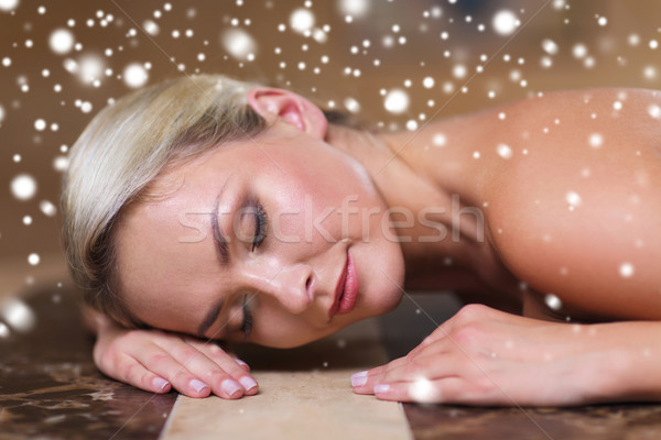 young woman lying on hammam table in turkish bath Stock photo © dolgachov