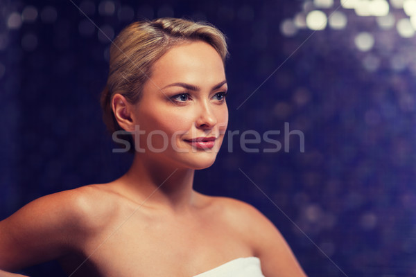 close up of young woman sitting in bath towel Stock photo © dolgachov
