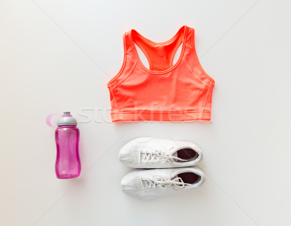 close up of female sports clothing and bottle set Stock photo © dolgachov