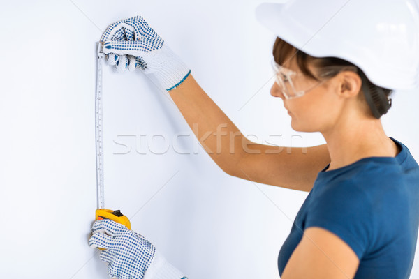architect measuring wall with flexible ruller Stock photo © dolgachov