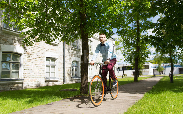 happy young hipster man riding fixed gear bike Stock photo © dolgachov