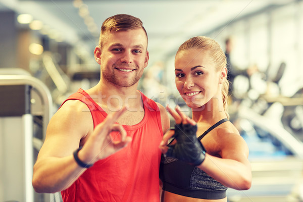 Stockfoto: Glimlachend · man · vrouw · tonen · handteken