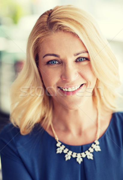 happy smiling blonde woman in blue clothes Stock photo © dolgachov