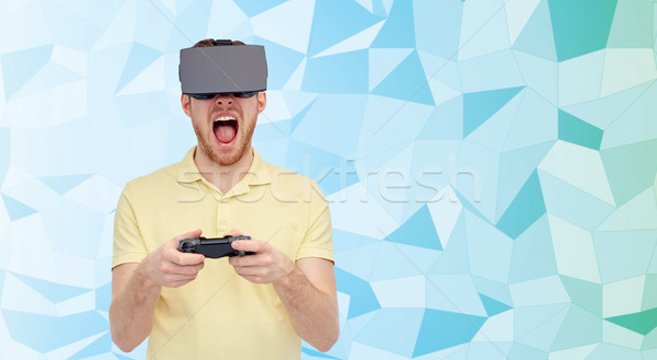 angry man in virtual reality headset with gamepad Stock photo © dolgachov
