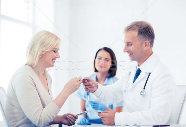 doctor giving tablets to patient in hospital Stock photo © dolgachov