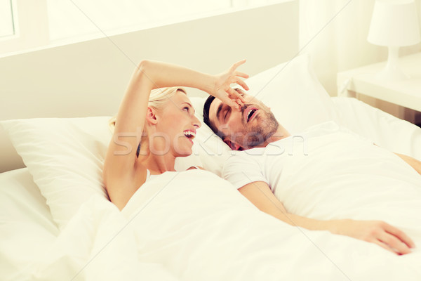 счастливым пару спальный кровать домой люди Сток-фото © dolgachov