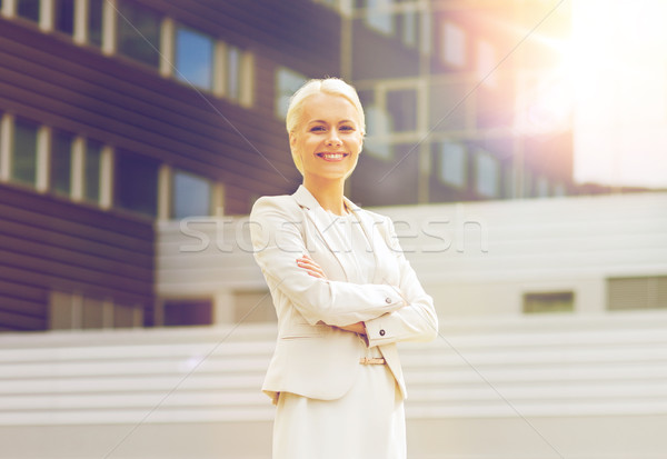 young smiling businesswoman with crossed arms Stock photo © dolgachov