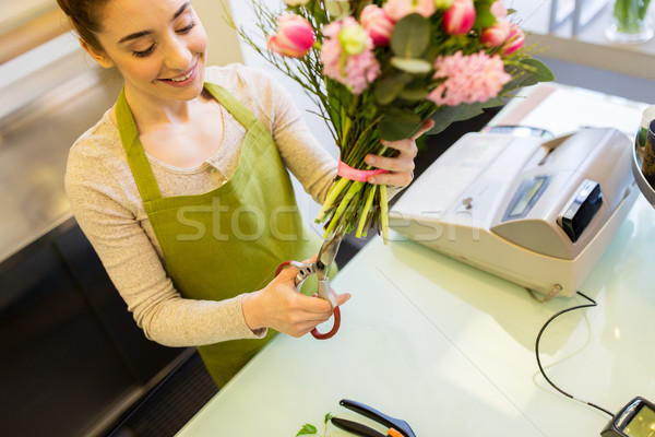 close up of woman with flowers and scissors Stock photo © dolgachov