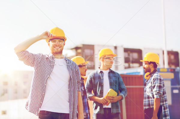 Groupe souriant constructeurs extérieur affaires bâtiment [[stock_photo]] © dolgachov