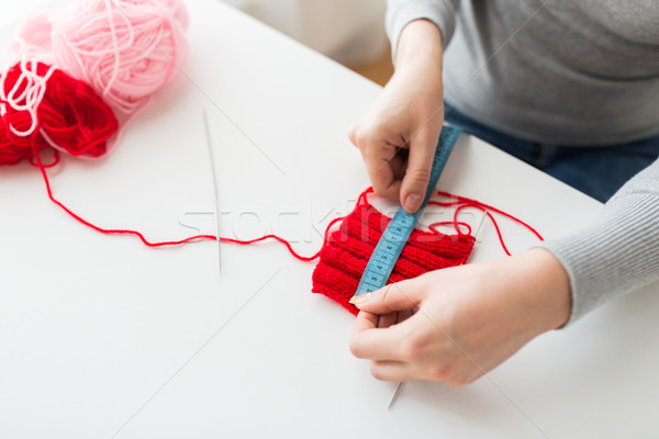 woman with knitting, needles and measuring tape Stock photo © dolgachov
