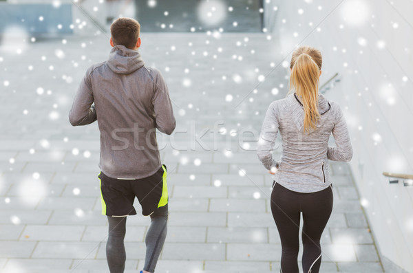 couple of sportsmen running downstairs outdoors Stock photo © dolgachov