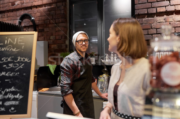 happy bartenders at cafe or coffee shop counter Stock photo © dolgachov