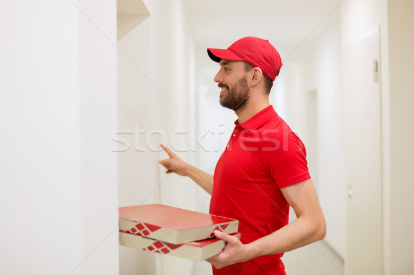 Mensajero pizza cajas timbre de la puerta alimentos entrega Foto stock © dolgachov