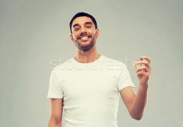 Mosolyog férfi férfi parfüm szürke illatszerbolt Stock fotó © dolgachov