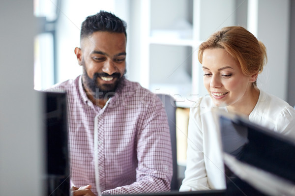 happy business team working at office Stock photo © dolgachov