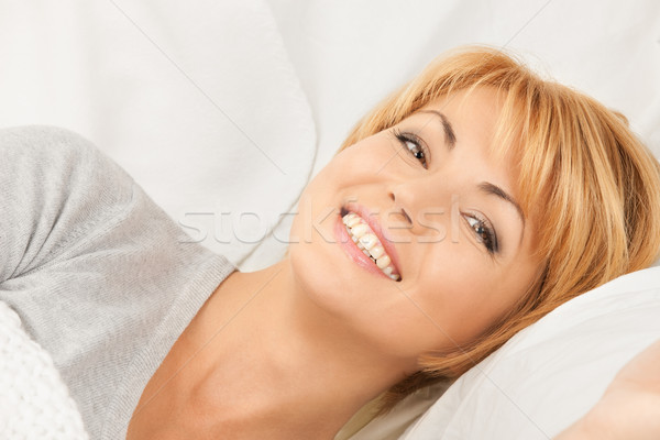 woman in bed Stock photo © dolgachov