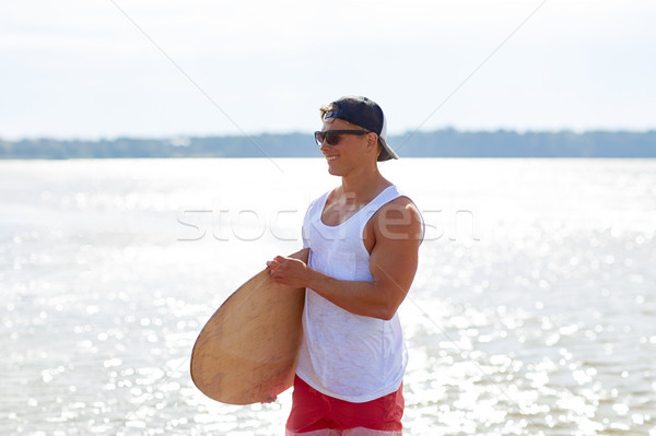 Glücklich junger Mann Sommer Strand Wasser Sport Stock foto © dolgachov