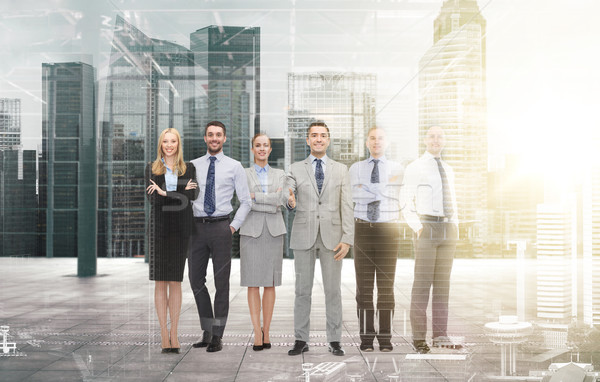 Stock photo: group of smiling businessmen making handshake