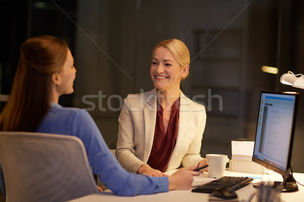 Stock photo: businesswomen talking late at night office