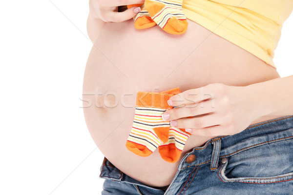 Mulher grávida barriga gêmeo meias quadro belo Foto stock © dolgachov