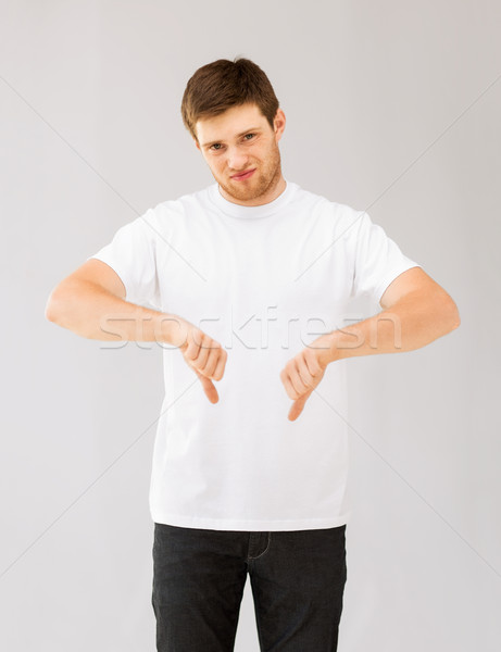 man showing thumbs down Stock photo © dolgachov