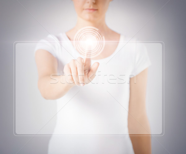 woman hand touching virtual screen Stock photo © dolgachov