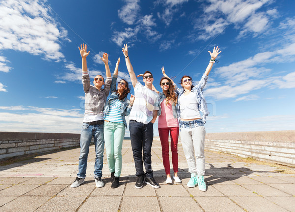 group of teenagers holding hands up Stock photo © dolgachov