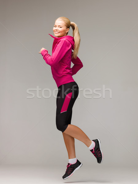 Vrouw lopen springen fitness sport Stockfoto © dolgachov