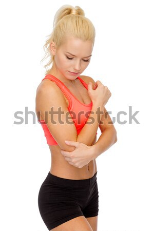 sporty woman with pain in elbow Stock photo © dolgachov